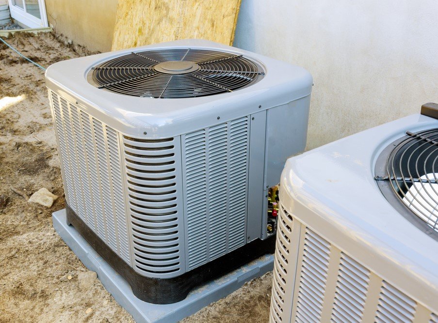 Outdoor heat pump units serviced for efficiency.